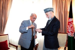 Rotary International President Kalyan Banerjee presenting the medal to Afghan President Hamid Karzai Rotary International
