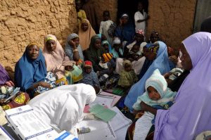Mothers gather at a health camp in northern Nigeria to get vaccines against polio and other diseases for their children. WHO/L.Dore