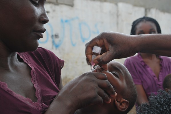 A child is immunized against wild poliovirus in Luanda, Angola, in October. The Republic of Congo is now tackling an explosive outbreak of wild poliovirus that is genetically related to virus that had been circulating in Angola. Melissa Corkum/UNICEF