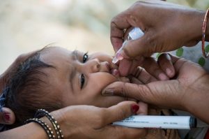 A child being vaccinated during the SNID monitoring in Saran district, Bihar/India. Hans Everest / WHO