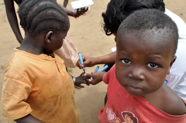 The Democratic Republic of the Congo, May 2011: A child's finger is marked with indelible ink after being vaccinated against polio. Christine Lamoureux/WHO