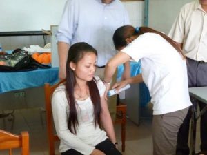 A Cambodian health worker trials the disposable syringe jet injector. Julian Bilous/Bill & Melinda Gates Foundation