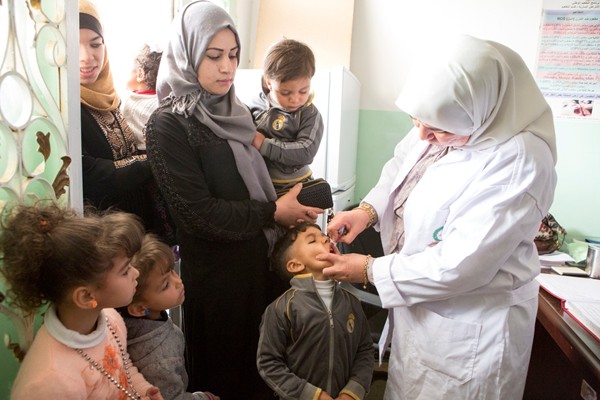 Children are vaccinated against polio in Jordan, a country that is at high risk of an outbreak. 