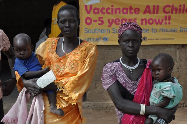 Mothers in South Sudan take their children to be vaccinated against polio. If a population is fully immunized, it will be protected against both wild poliovirus and cVDPV. 