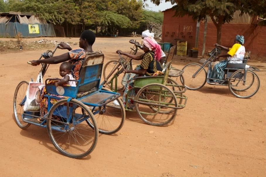 The tricycles are hand-crank operated by the individual to navigate the difficult roads of Burkina Faso. A wider version is also available for adults riding with children and the chairs can be tailor-made in a variety of colours. ©Rotary