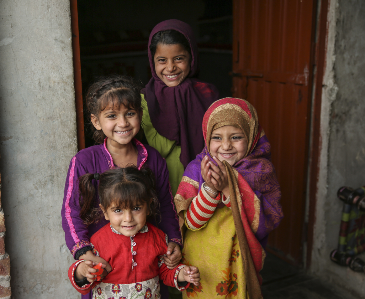 Young girls outside their home during vaccination activities in Punjab province, Pakistan. © WHO EMRO