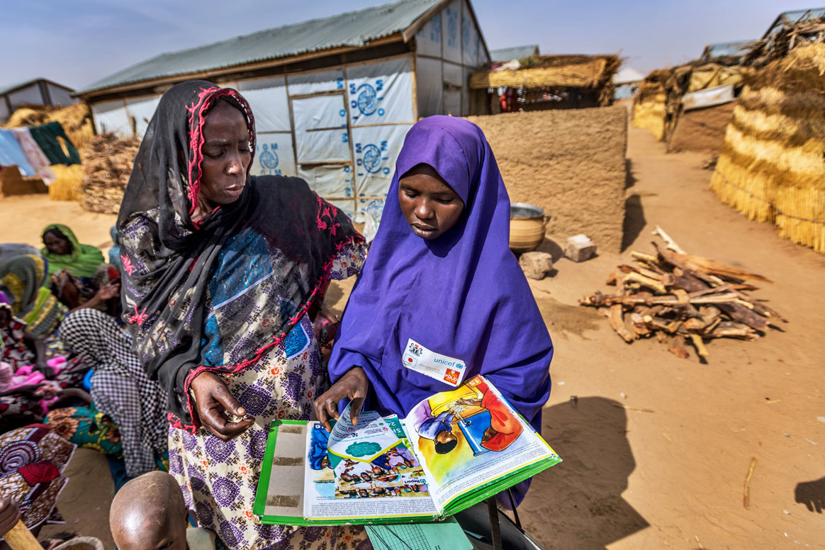 Fatima Umar, a volunteer, is educating Hadiza Zanna about health topics such as hygiene and maternal health, in addition to why polio vaccination is so important. ©Rotary International