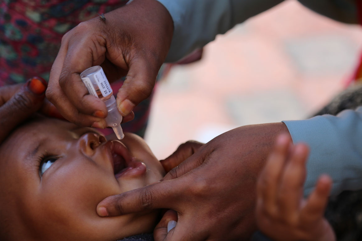 Seven-month-old Abdihakim Osman receives double doses of the oral polio vaccine during a national immunization campaign in Hargeisa, Somaliland. G20 members are some of the most committed supporters of polio eradication efforts. ©WHO/Ilyas Ahmed