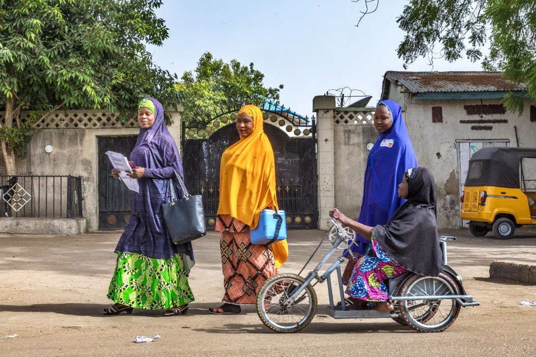 Falmata Mustapha uses her hand-operated tricycle for door-to-door campaigns. ©Rotary International