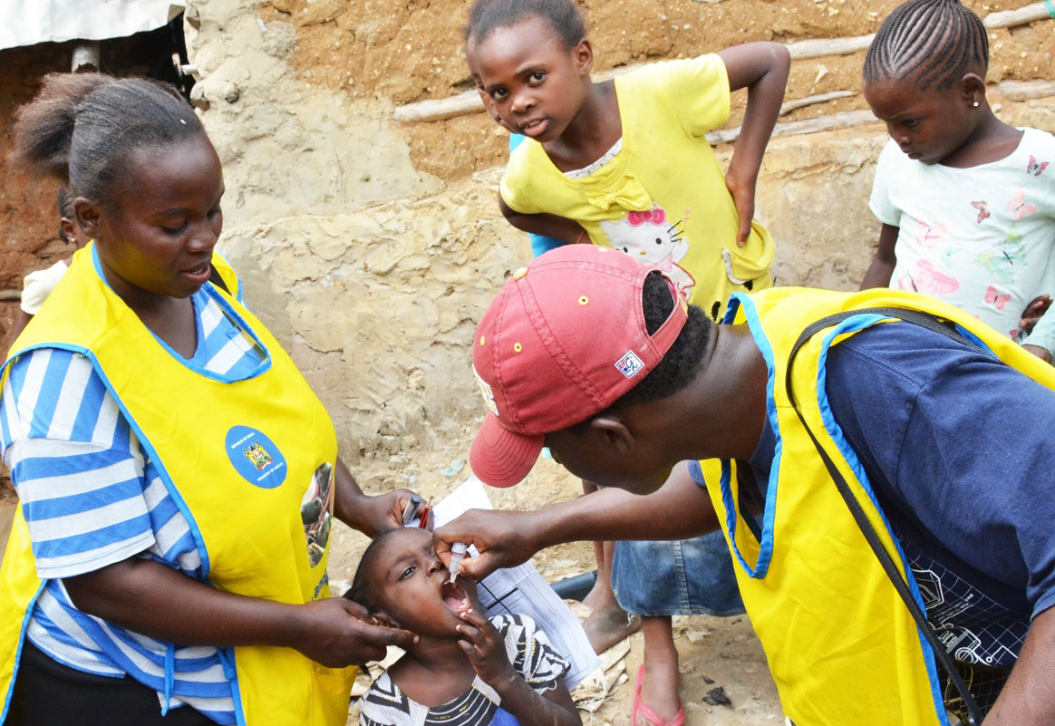 A vaccine is administered to a child during a polio immunization campaign. ©WHO/AFRO