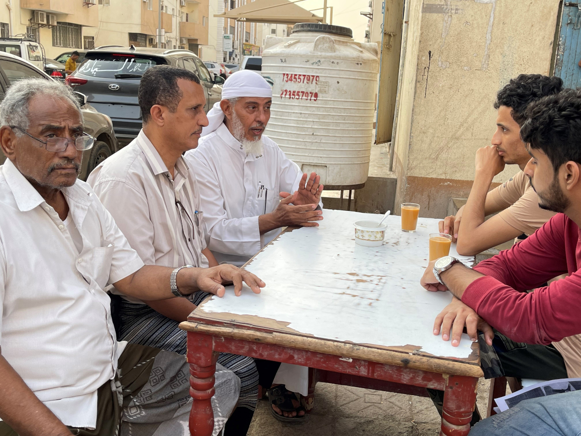 Dr. Nabeel (third from left) speaking with male members of a local community on the benefits of vaccination for children’s health and well-being. Photo: ©UNICEF Yemen