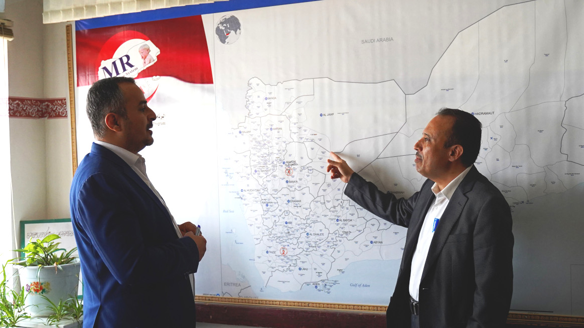 Dr Mutahar Ahmed, R, reviewing the location of AFP cases with Dr Khaled Al-Moayad, Director of Disease Control and Surveillance in Sanaa, Yemen © Omar Nasr / WHO Yemen